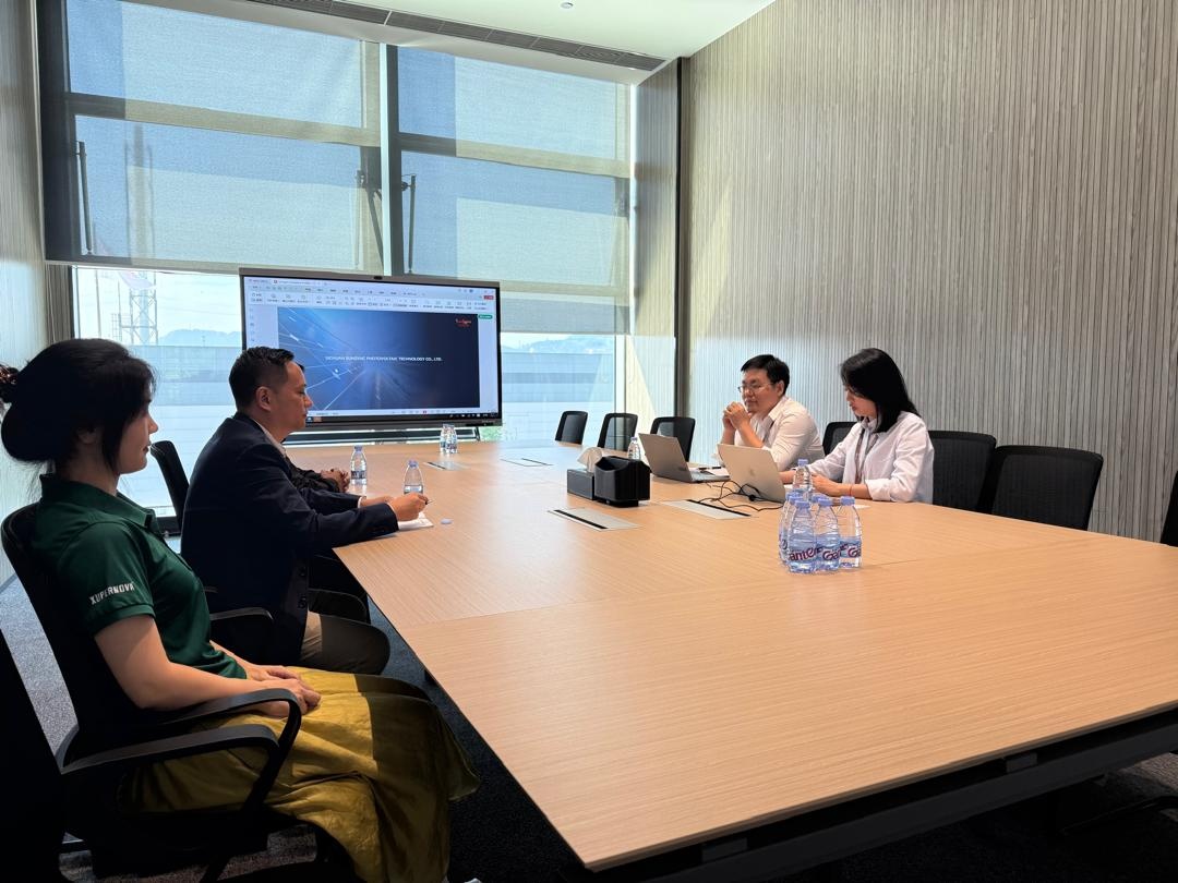 Technical partnership discussion around a boardroom table