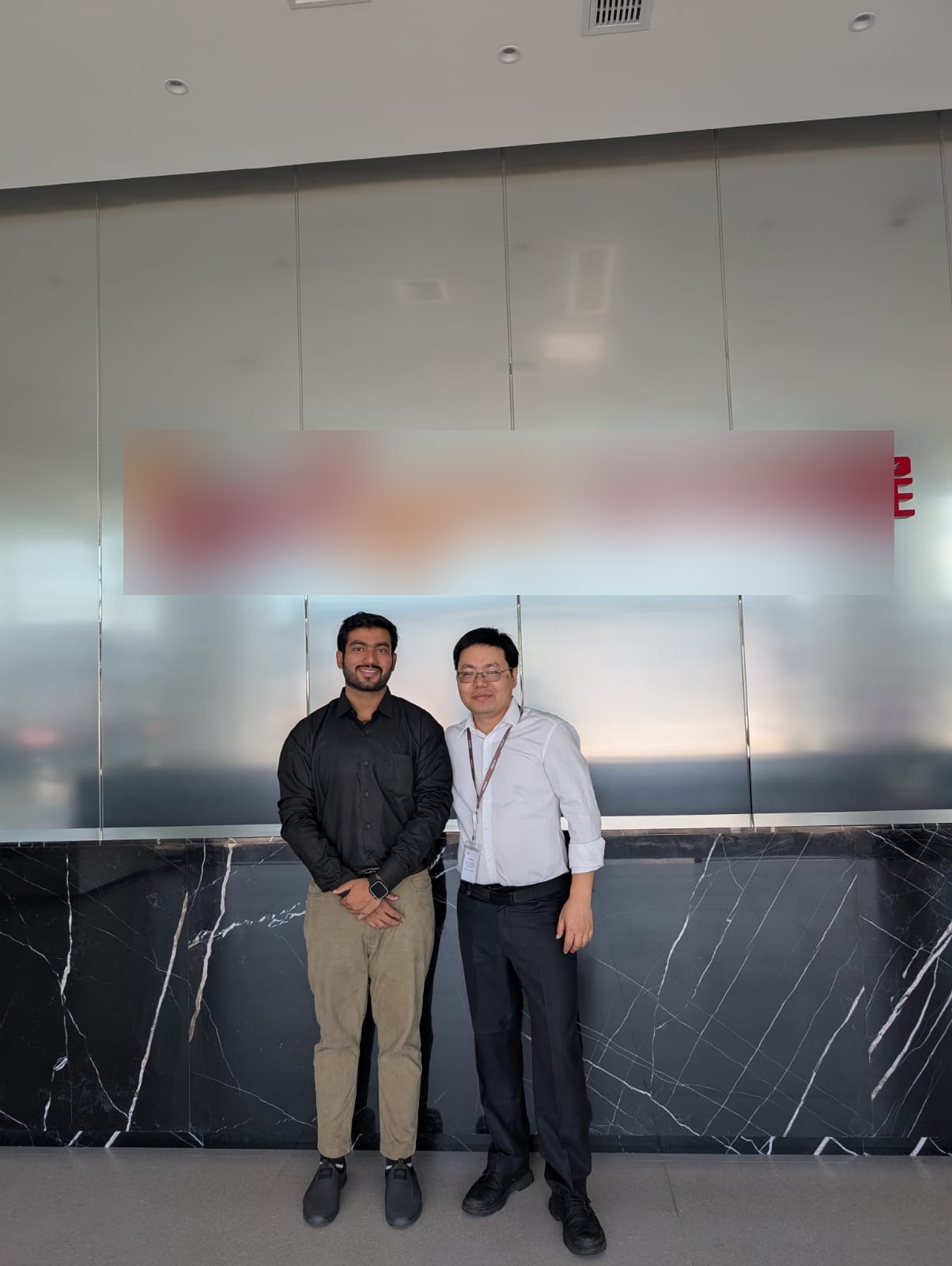 Charginity team member with a technology partner representative at a company reception